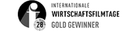 Logo "Internationale Kurzfilmtage 26 - Gold Gewinner" in schwarz-weißer Gestaltung mit Filmrollen-Symbol